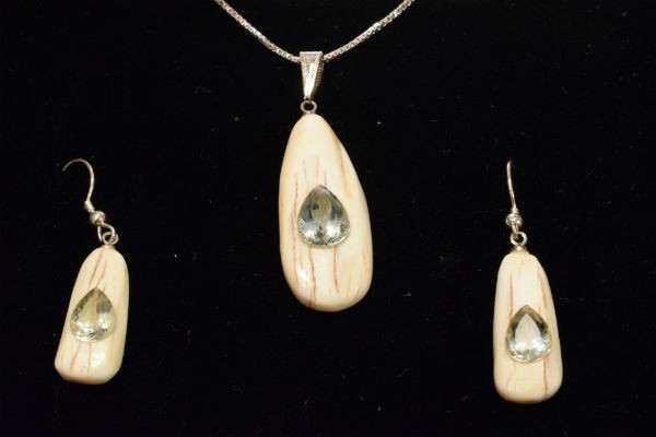Alaskan Native crafted ivory with pear cut natural green Beryl as center stones of this stunning earring pendant set