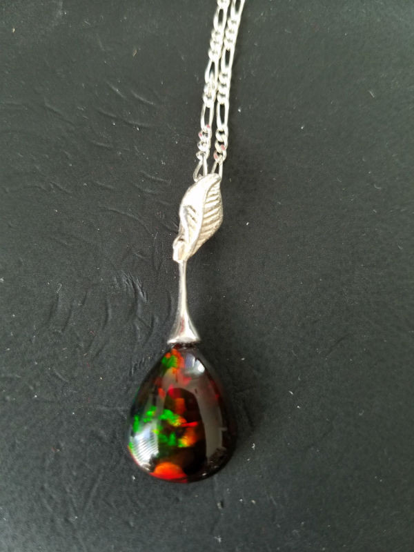 Stunning Alaskan Native crafted Gemstone Pendant created from a finely cut Australian Black Opal to make this uniquely stunning piece of Fine Jewelry for all occasions