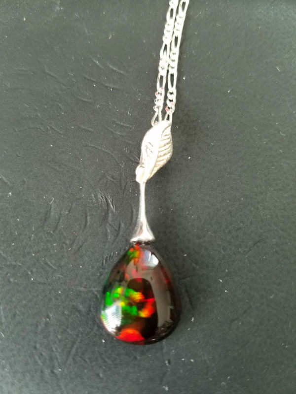 Stunning Alaskan Native crafted Gemstone Pendant created from a finely cut Australian Black Opal to make this uniquely stunning piece of Fine Jewelry for all occasions