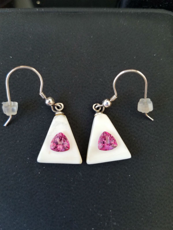 Alaskan Native crafted ivory with featuring natural pink trillion topaz as center gemstones of this unique earring set