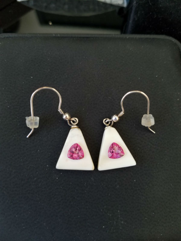 Alaskan Native crafted ivory with featuring natural pink trillion topaz as center gemstones of this unique earring set