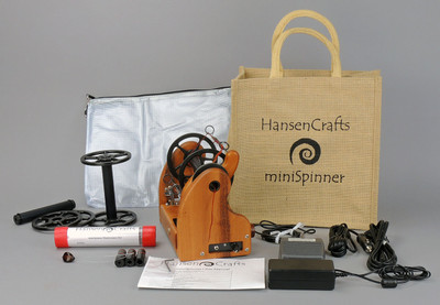 The Ultimate E-Spinner, the HansenCrafts miniSpinner Pro, in Tigerwood! The Pro includes 2 additional HansenCrafts Standard or 3 additional HansenCrafts Lace bobbins, gear bag, maintenance kit, and orifice reducer set.
