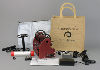 The Ultimate E-Spinner, the HansenCrafts miniSpinner Pro, in Purpleheart! The Pro includes 2 additional HansenCrafts Standard or 3 additional HansenCrafts Lace bobbins, gear bag, maintenance kit, and orifice reducer set.