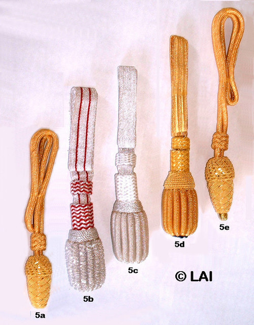 Civil War officers sword knots in metallic gold and silver finishes, featuring traditional acorn tassels and cord wrapping designed for attachment to an officer sword hilt, including General Officer variations with bead detailing.