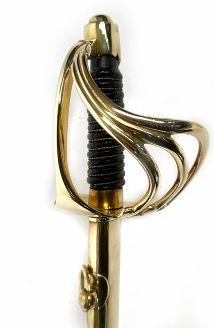 French Napoleon Dragoon sword with brass cavalry hilt and leather scabbard for historical display.