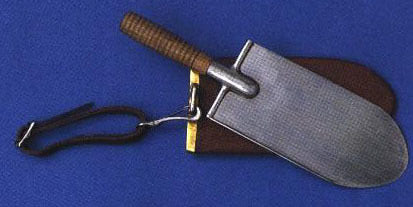 Historical US Army entrenching tool featuring a wooden handle.