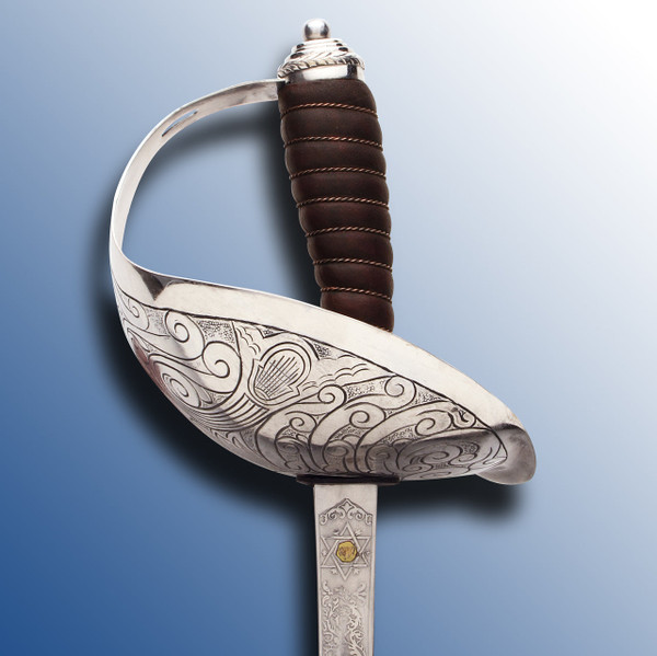 1912 U.S. Cavalry Officer’s sword with nickel plated basket hilt and Sam Browne scabbard.