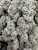 Han Solo Burger showcases dense, hand-trimmed buds drenched in a thick blanket of shimmering trichomes, with vibrant green hues and fiery orange pistils that deliver undeniable top-shelf bag appeal. Bursting with bold notes of diesel, garlic, and earthy spice, this premium sativa offers a smooth, flavorful smoke paired with uplifting, energetic effects that inspire creativity, sharpen focus, and keep you moving throughout the day. Perfect for those seeking a potent daytime strain with exceptional flavor, eye-catching frost, and a memorable experience.