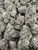 Racing Gaz is a premium top-shelf cultivar featuring dense, chunky buds blanketed in a thick layer of glistening trichomes. Rich emerald-green flowers with subtle purple accents and vibrant orange pistils create exceptional bag appeal, showcasing its high-quality craftsmanship. Its terpene profile bursts with bold notes of pungent diesel, sweet citrus, earthy pine, and a hint of creamy spice, delivering a smooth, flavorful smoke with a lingering gassy finish. Racing Gaz provides a powerful, well-balanced experience that begins with an uplifting wave of euphoria and mental clarity before easing into a soothing full-body relaxation, making it an excellent choice for those seeking bold flavor, premium bag appeal, and long-lasting effects.