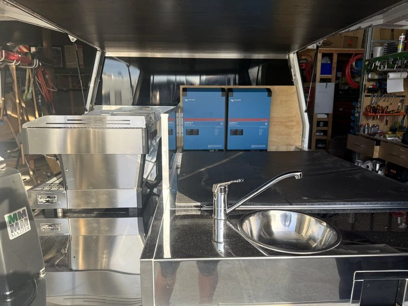 Twin Victron MultiPlus-II 48V inverter-chargers powering a commercial espresso machine and grinder in a mobile fit-out by RV Solutions