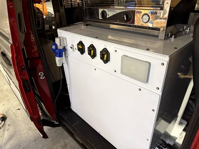 Custom power distribution cabinet with labelled breakers in a 48V RV system built by RV Solutions