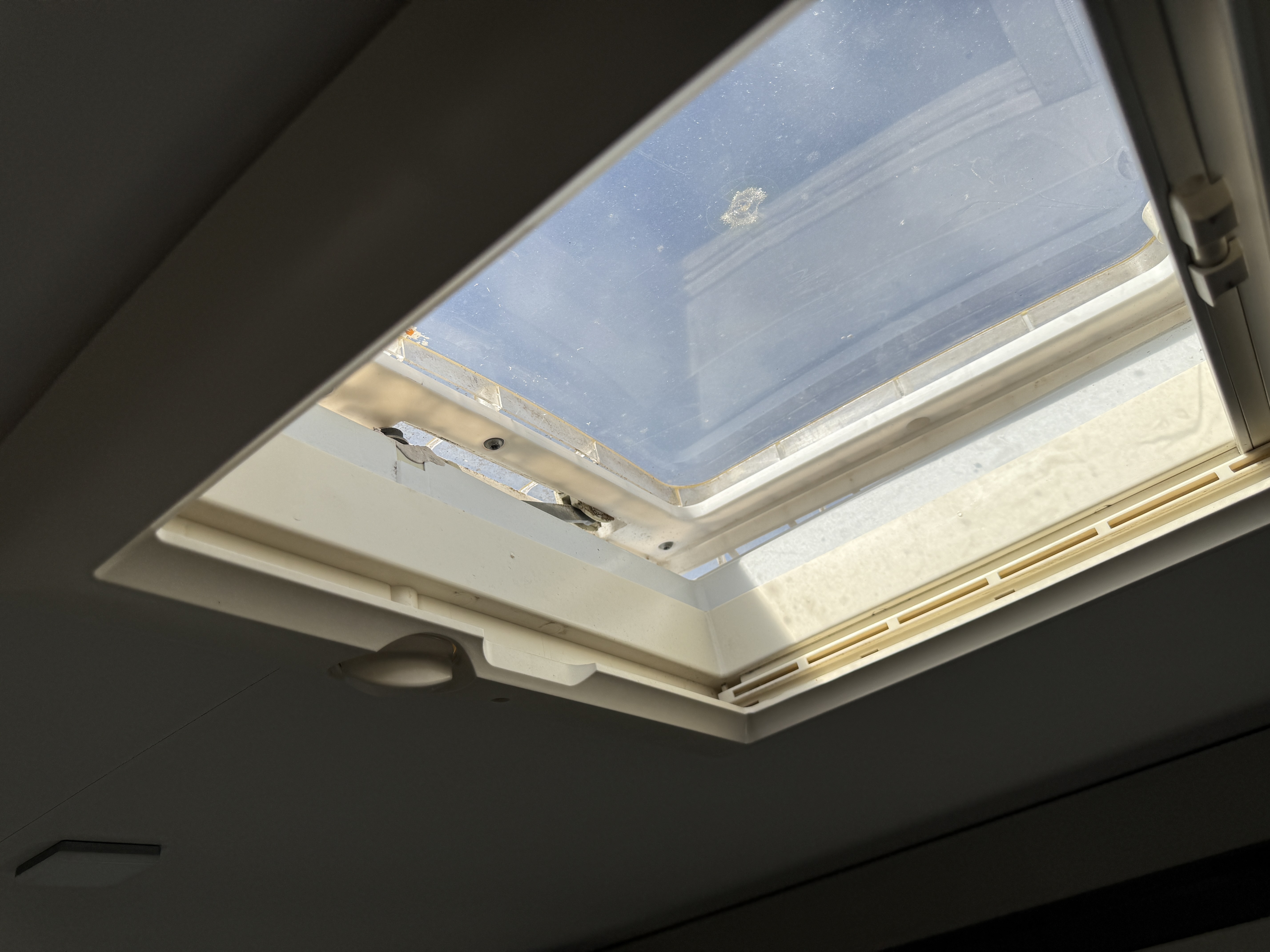 Roof vent installation on campervan