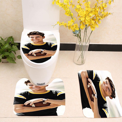 Zac Efron holding football Toilet cover set up