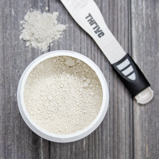 Thrive Diatomaceous Earth powder with scoop
