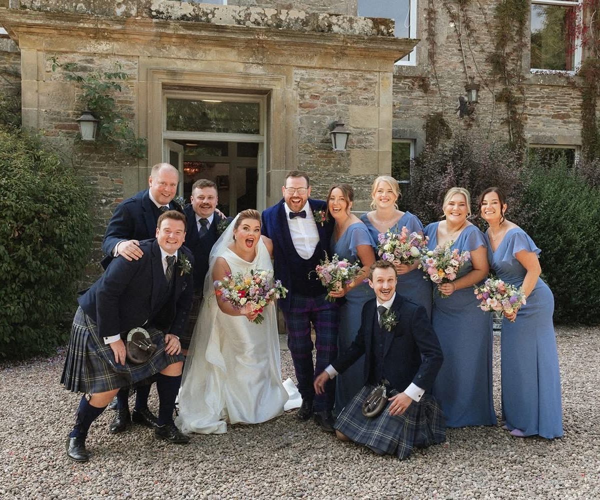 A wedding party wearing hired kilts