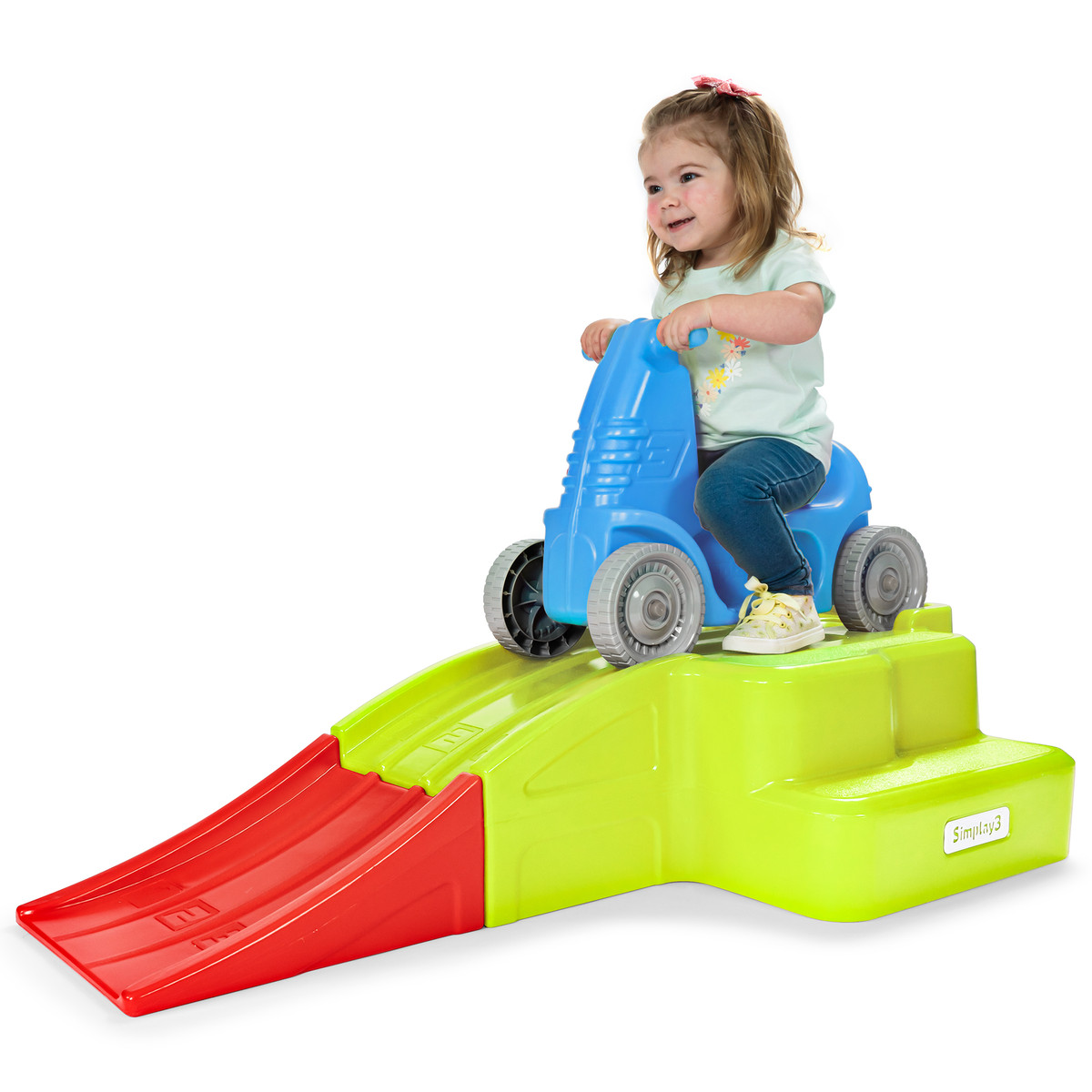Toddler girl riding the Simplay3 Downhill Thrill Roller Coaster
