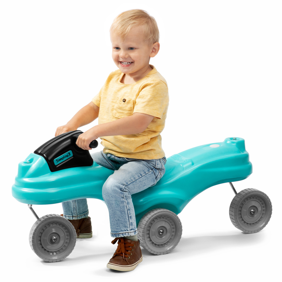 Toddler boy riding the Simplay3 360 Spin Rider