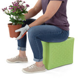 Woman using multi-level Handy Home Seat to garden