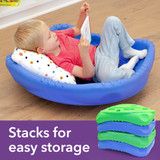 Toddler with pillow reading in Wobble Disk XL