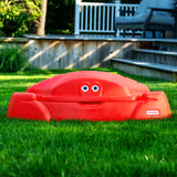Red Simplay3 Coastal Crab Sandbox in grass in backyard