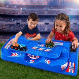 Boy and girl racing cars and trucks on the simplay3 carry and go train and track table