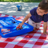 little boy driving red car across Simplay3 America 250 Carry and Go Track Table