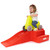 Child seated in ride on car ready to coast down at home roller coaster ramp