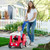Mom pushing toddler girl in red, white and blue roll and stroll