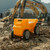 Yellow Simplay3 Rugged Rider Dump Truck in a construction zone