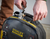 STANLEY FATMAX Heavy-Duty Tool Bag Backpack showing rigid waterproof base and front zip pocket