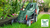 Bosch EasyRotak 32-225 green electric lawnmower with 31L grass box and Ergoflex handles.