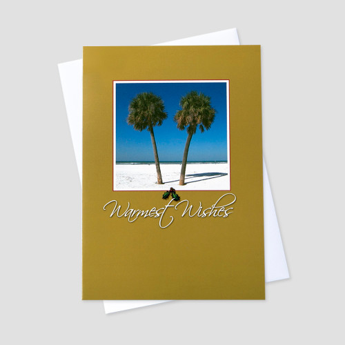 Business Holiday greeting card featuring warmest wishes below a palm tree and beach image