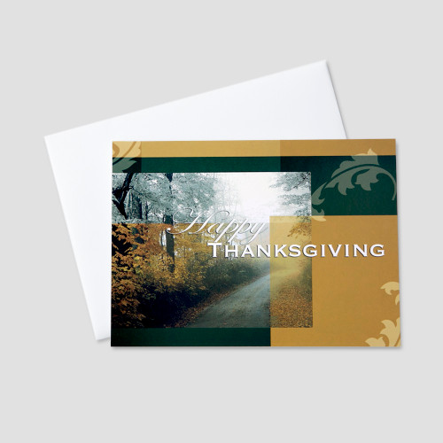 Business Thanksgiving greeting card featuring a country road with colorful autumn leaves