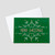 Company Christmas greeting card featuring Merry Christmas within a snowflake in red and green Christmas colors