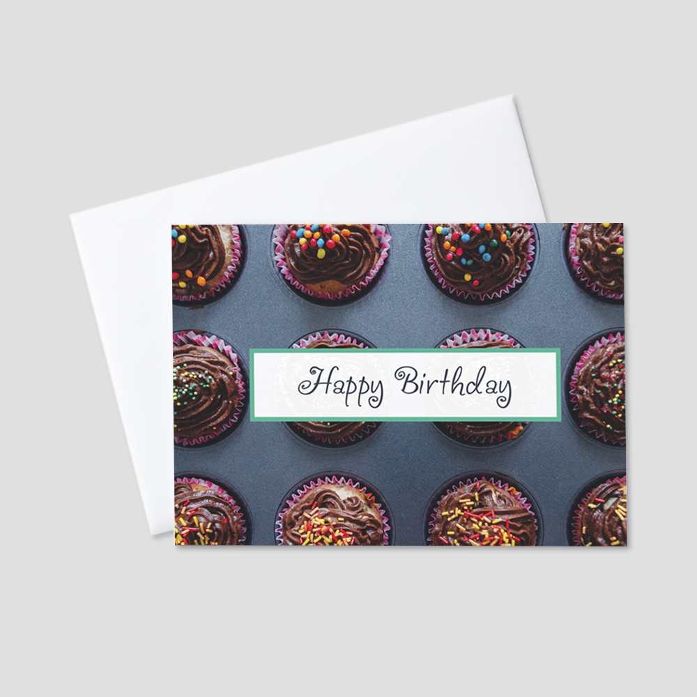 Festive Birthday greeting card featuring a fun Happy Birthday message against a background of delicious, colorful cupcakes