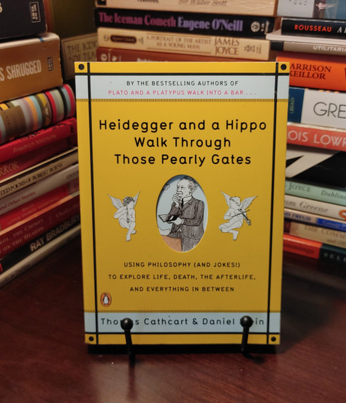 Heidegger and a Hippo Walk Through Those Pearly Gates is a witty philosophy-meets-humor exploration of life, death, and what comes after. With sharp insights into thinkers like Heidegger, Descartes, Kierkegaard, and Schopenhauer, the authors sprinkle in clever quips—yes, even a joke about a hippo strolling through heaven—to make profound concepts fun and relatable . Whether citing country songs or sitcoms, Cathcart and Klein walk you through mortality in a way that’s both enlightening and entertaining—a smart, lighthearted survey of "the Big D."