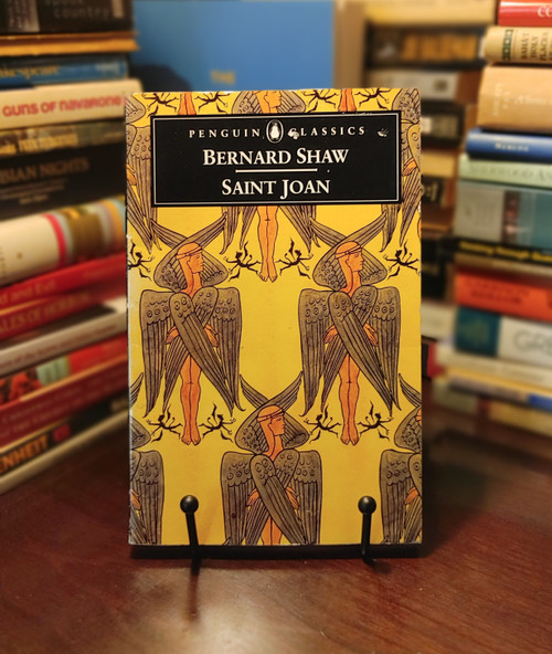 Bernard Shaw’s Saint Joan dramatizes the life, trial, and martyrdom of Joan of Arc, blending historical detail with philosophical insight. Shaw examines courage, faith, and individual conscience versus societal expectation, creating a portrait of a heroic yet human figure whose convictions challenge the powers of her time. Intellectually rigorous and dramatically powerful, the play remains a staple of 20th-century theater.

Includes "On Playing Joan" by JImogen Stubbs


This is one of the many featured books in my Whatnot Live Buy-it-Now auction. However, if you purchase the book directly on my store website, you will receive one dollar off by entering the coupon code TAKE1OFF.