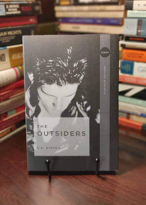 A timeless coming-of-age classic, The Outsiders tells the unforgettable story of Ponyboy Curtis, a thoughtful teenager caught between two rival worlds: the working-class Greasers and the privileged Socs. As friendships are tested and violence escalates, Ponyboy struggles to find his place in a society divided by class, loyalty, and prejudice. Written when S. E. Hinton was just sixteen years old, this groundbreaking novel revolutionized young adult literature with its authentic teenage voice, emotional honesty, and enduring themes of identity, belonging, compassion, and hope. More than half a century after its publication, The Outsiders continues to resonate with readers of all ages and remains one of the most influential novels in American literature.