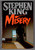 In Misery, bestselling novelist Paul Sheldon has just killed off his most famous character and is desperate to move on. But when a blizzard forces him off the road and he’s rescued by Annie Wilkes, his self-proclaimed “number one fan,” he finds himself trapped in her remote home—and at her mercy. Annie is wounded, unpredictable, and insistent that Paul resurrect his heroine. As her demands grow more extreme, Paul must confront a horrifying question: is he captive in someone’s devotion, or a writer whose life is being rewritten by a madwoman?