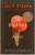 The Buddha in the Attic is a lyrical and haunting novel that traces the collective voices of young Japanese “picture brides” who journey to early‑20th‑century America to marry men they’ve never met. Told in an extraordinary first‑person plural narrative, Otsuka’s spare, poetic prose captures the hardships, dreams, cultural dislocation, and resilience of these women — from their crossing of the Pacific and life in San Francisco, to the struggles of work, family, and cultural identity, and ultimately to the wartime upheavals that forever alter their lives. Winner of the PEN/Faulkner Award and a National Book Award finalist, this elegant novel offers a powerful meditation on memory, belonging, and the shaping of American identity.