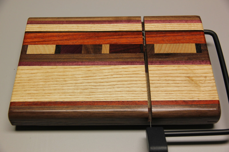 Cheese slicer. Available in cherry , walnut and maple.