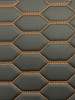 Quilted automotive grade black vinyl with orange stitching