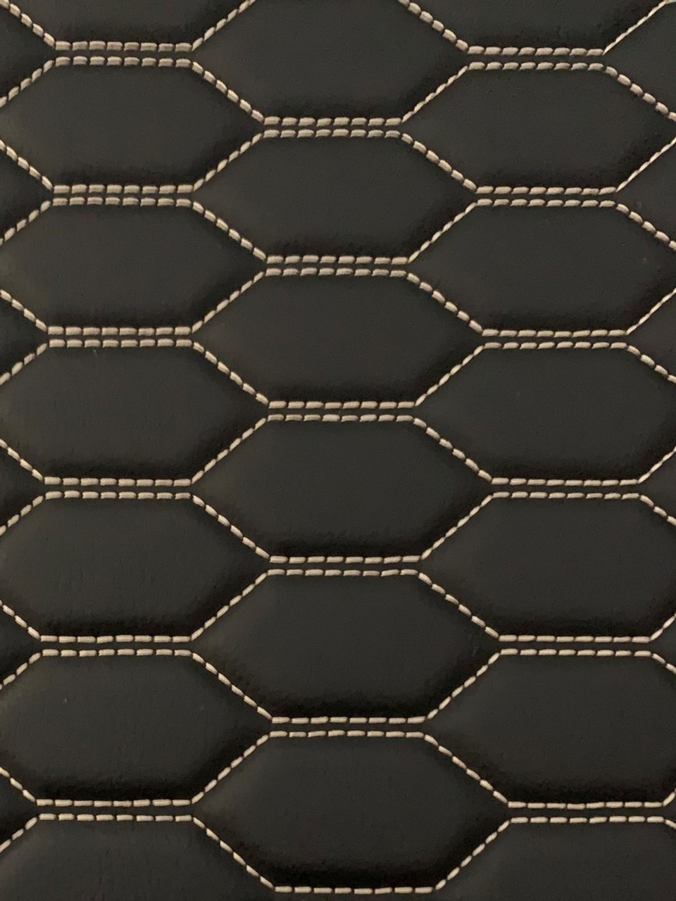 Quilted automotive grade black vinyl with white-gold stitching