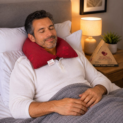 man using heated neck pillow