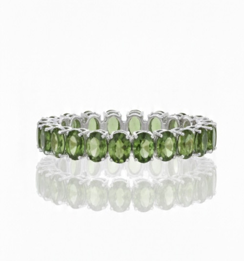 Close up of natural peridot oval gemstones set in 925Chic sterling silver bracelet