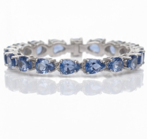 Atelier Gems Natural blue topaz bracelet displayed on Surface table
