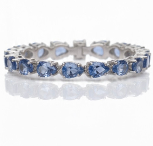 Atelier Gems Natural blue topaz bracelet displayed on Surface table