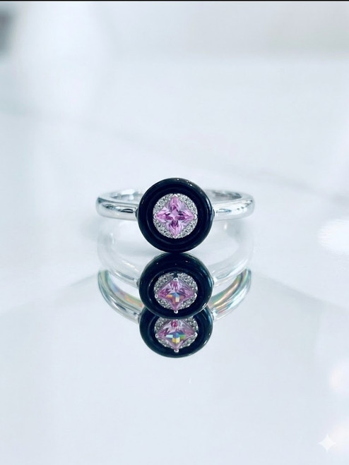 Side view of rose quartz ring with rhodium finished setting