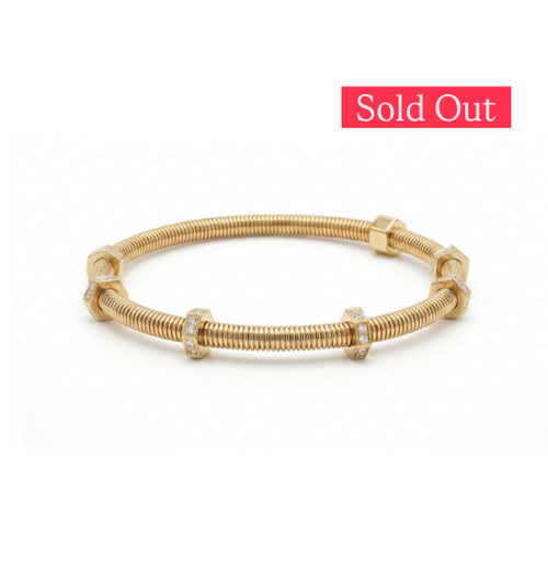 close up  14k gold bangle with cubic zirconia nut accents wrist modern jewelry birthaday