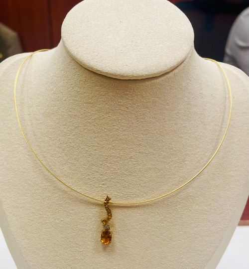 Unique 14K gold Citrine necklace displayed on jewelry bust
